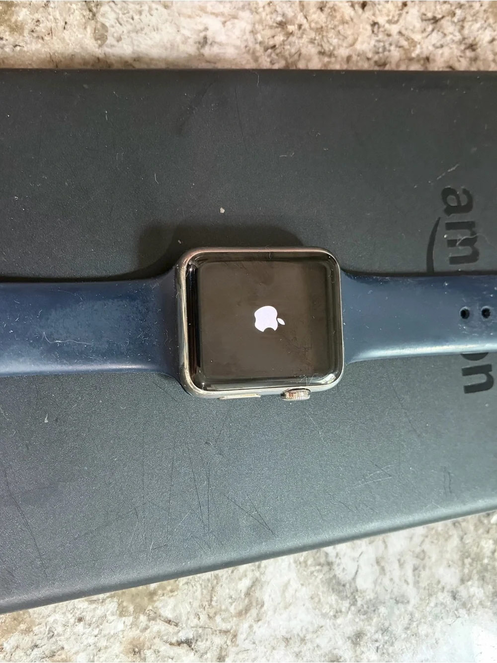 Apple Watch with Navy Blue Sport Band and White Charger